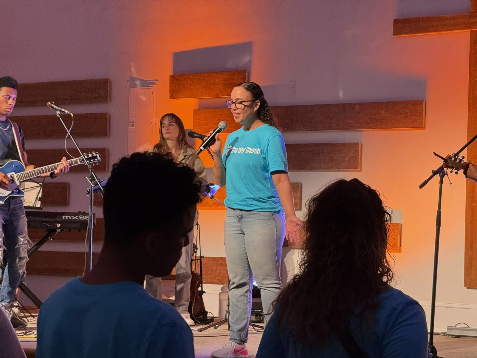 Audio booth view during a church service with an operator mixing from the control position