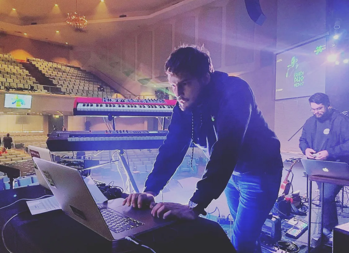 Church audio engineer operating a live mixing console