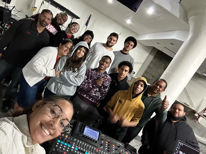 Church production team gathered together in a control-room environment