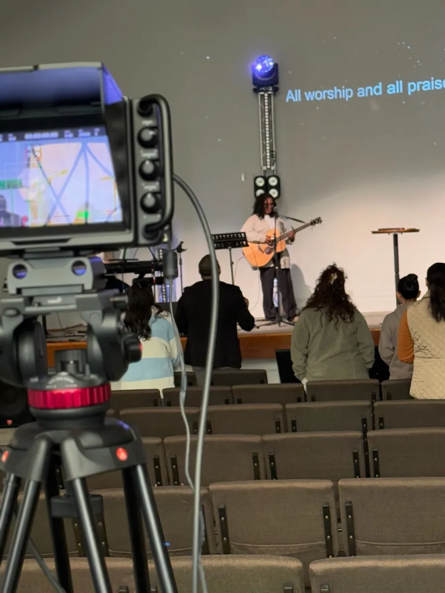 Francisco Gaviria, founder of Heavenly AVI, working on A/V equipment